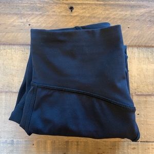 Black Lululemon crop leggings with sheer detail